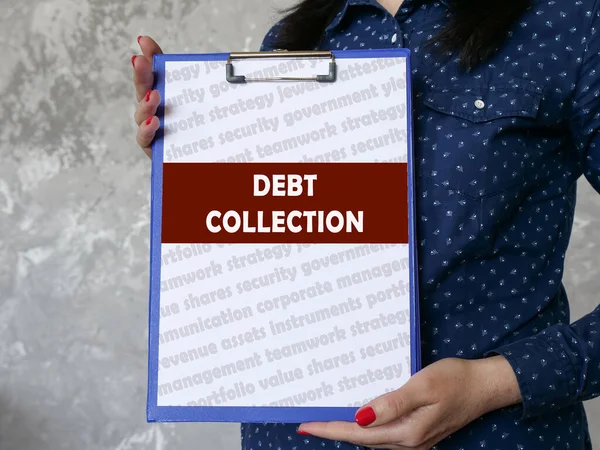 Business concept meaning DEBT COLLECTION with inscription on the sheet.
