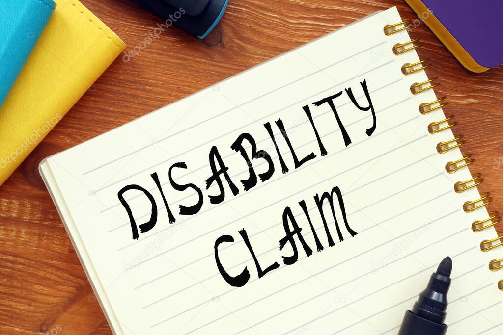 Financial concept about DISABILITY CLAIM question marks with inscription on the sheet.