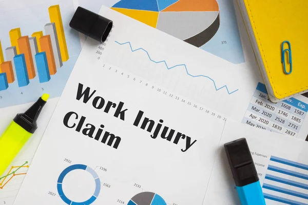 Business concept about Work Injury Claim with sign on the piece of paper.