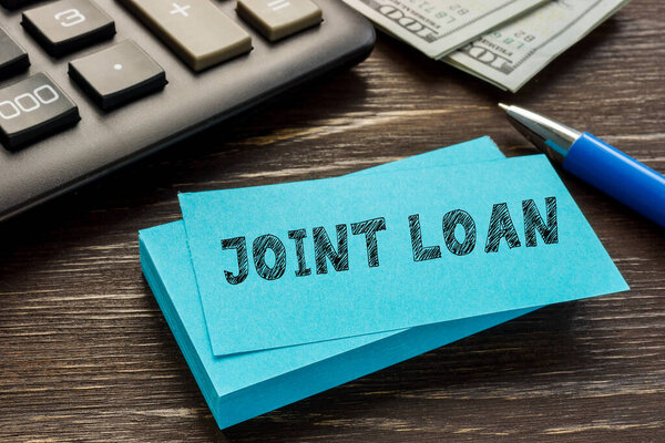 Business concept meaning JOINT LOAN with inscription on the sheet.