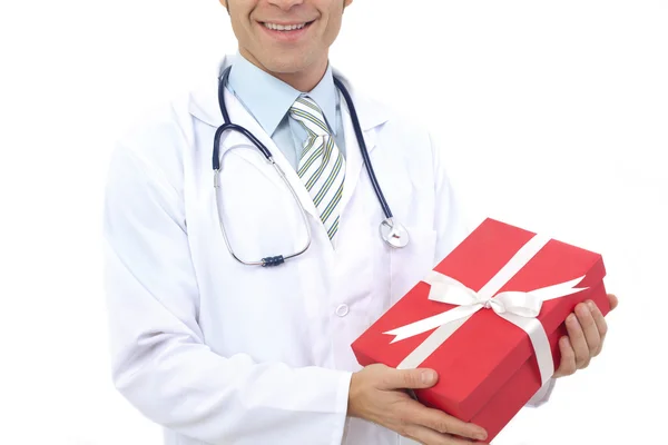 Medical doctor holding gifts in hands — Stock Photo, Image