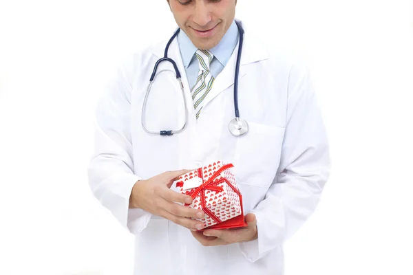 Medical doctor holding gifts in hands — Stock Photo, Image