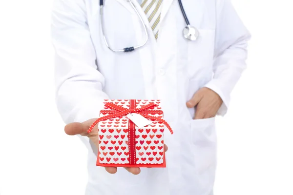 Medical doctor holding gifts in hands — Stock Photo, Image