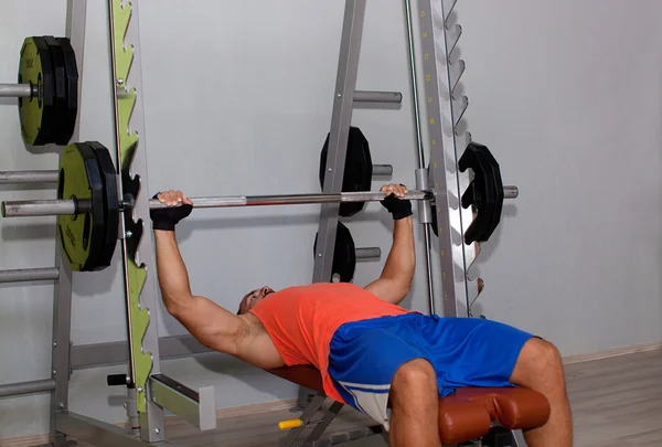 Muscular man on Bench press exercises