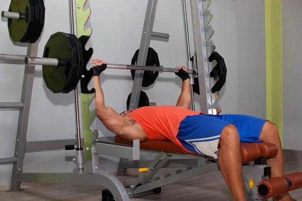 Muscular man on Bench press exercises