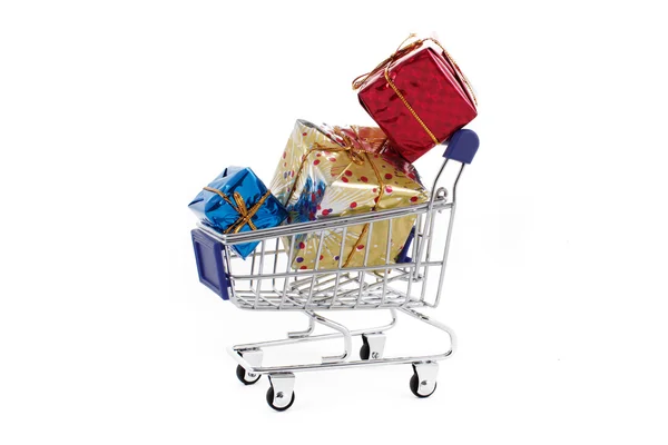 Shopping cart with colorful gift boxes isolated on white backgro — Stock Photo, Image