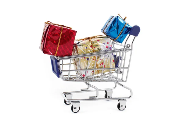 购物车与彩色礼品盒隔离在白色背毛 免版税图库图片