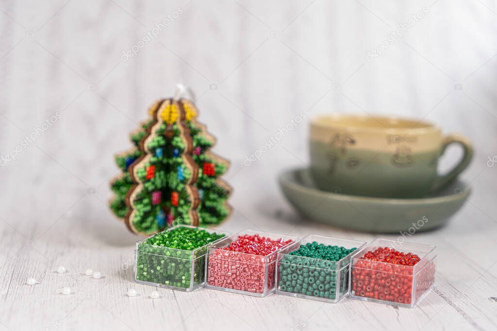 Colorful glass beads with christmas tree. Variety of shapes and colors to make a bead necklace or a string of beads women