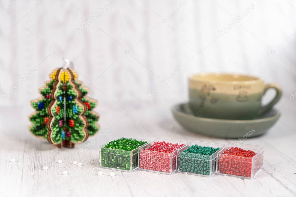 Colorful glass beads with christmas tree. Variety of shapes and colors to make a bead necklace or a string of beads women