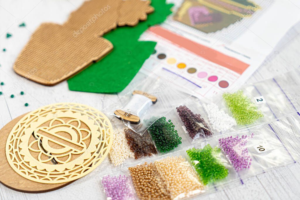 Set for beading. Beads in packages. Threads embroidery in the palette