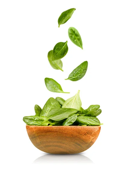 Isolated Spinach Leaves Falling Wooden Plate Isolated White Background — Stock Photo, Image