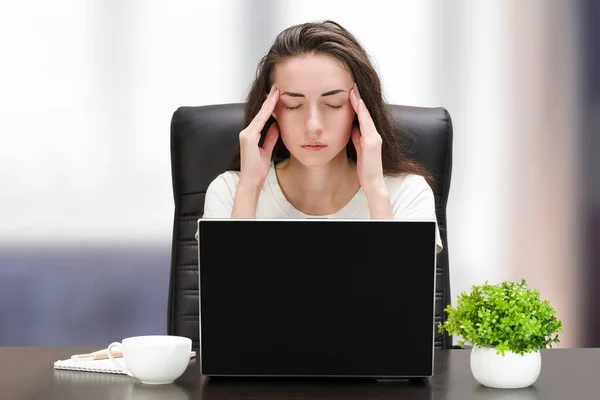 tired woman with headache working at computers at home