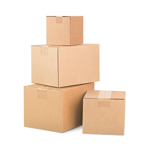 Quatre Boîtes Carton Empilées Dans Une Pile Sur Fond Blanc — Photo
