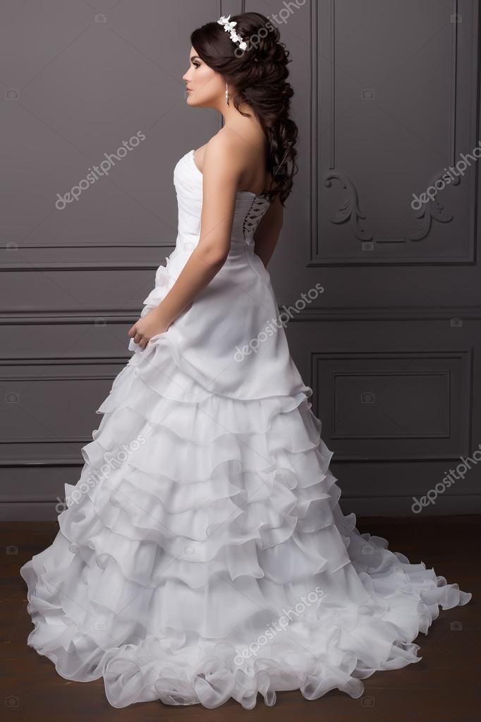Beautiful gentle girl groom in a wedding dress with hairstyle and make-up, hair decorated with a wreath of flowers Stock Photo by ©Tanyunya2014 102356808 Beautiful gentle girl groom in a wedding dress with hairstyle and make-up, hair decorated with a wreath of flowers Stock Photo by ©Tanyunya2014 102356808