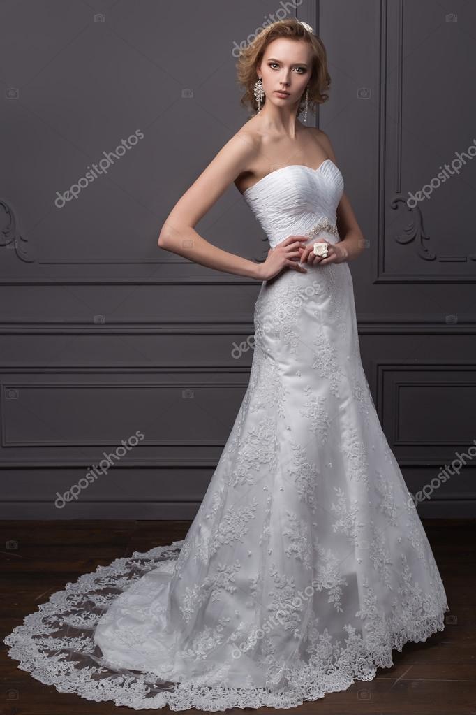 Beautiful gentle girl groom in a wedding dress with hairstyle and make-up, hair decorated with a wreath of flowers Stock Photo by ©Tanyunya2014 102358296 Beautiful gentle girl groom in a wedding dress with hairstyle and make-up, hair decorated with a wreath of flowers Stock Photo by ©Tanyunya2014 102358296