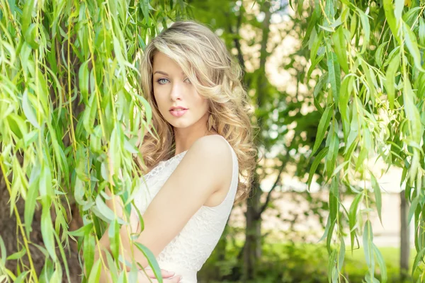 Portrait of a beautiful sexy girl with big full lips, with white hair in a white dress — Stock Photo, Image