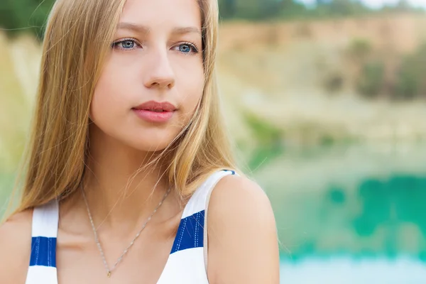 Portrait of beautiful sexy girls with full lips and blond hair stands near the lake — Stock Photo, Image