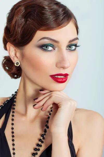 Beautiful young sexy woman with evening makeup and hair, with red lipstick — Stock Photo, Image