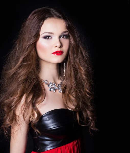 Portrait of a beautiful sexy elegant girl in evening dress with a large necklace with a bright festive makeup Studio — Stock Photo, Image