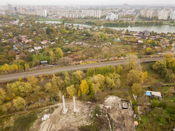 Aerial drone view. Railroad through the private sector in Kiev in autumn.