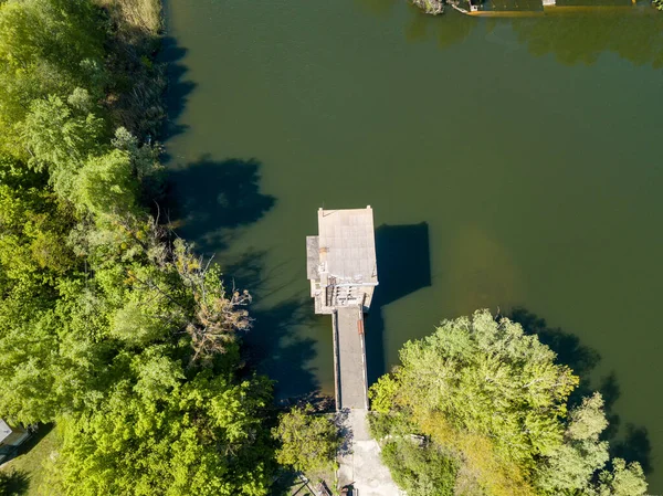 Aerial drone view. Brick house on the pier.