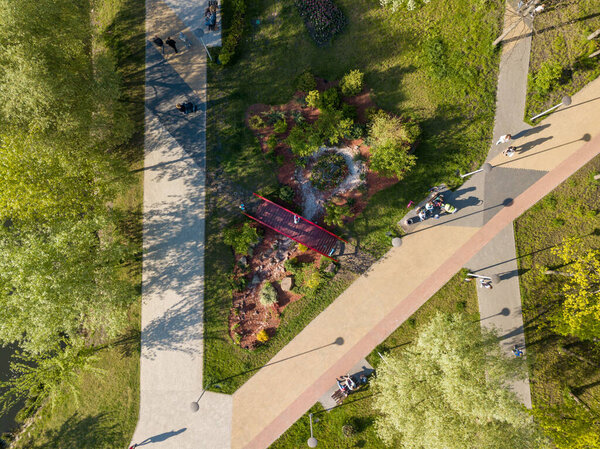 Aerial drone top view. Walking paths in the park.