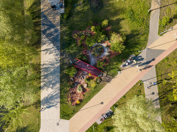 Aerial drone top view. Walking paths in the park.