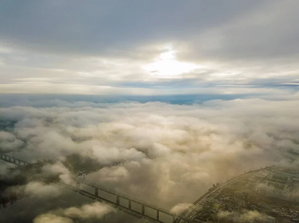 Aerial drone view. Railway bridge in Kiev, shrouded in morning fog.
