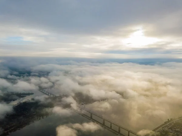 Aerial drone view. Railway bridge in Kiev, shrouded in morning fog.