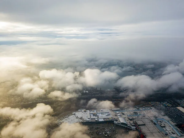 Aerial drone view. Low clouds over the Dnieper river in Kiev. Foggy autumn morning.