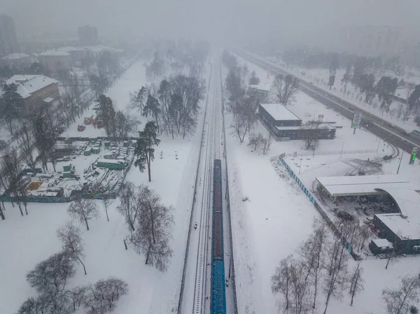 Kiev metro line in a snowstorm. Aerial drone view. Winter snowy morning.