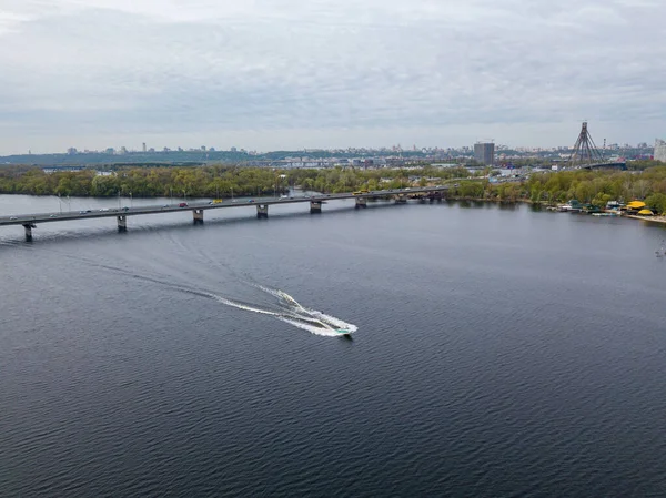 Motor boat with water skis on the river. Aerial drone view.