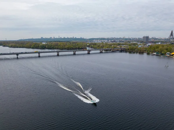 Motor boat with water skis on the river. Aerial drone view.