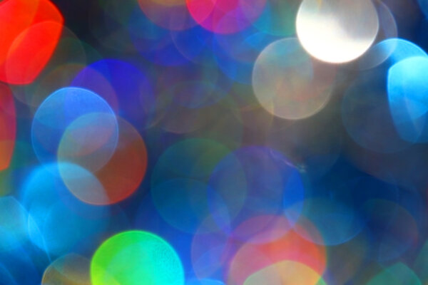 Colored blur defocused background with bokeh effect. Blue tone