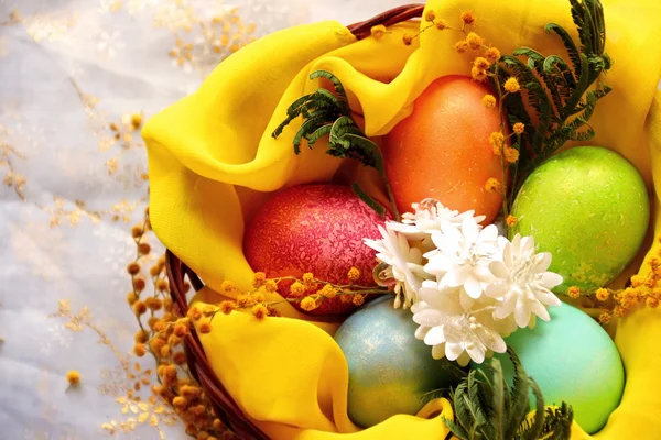 Easter eggs in basket, painted in different colors with pearly shimmer — Stock Photo, Image