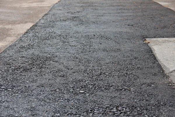 Neatly patched asphalt in pavement — Stock Photo, Image