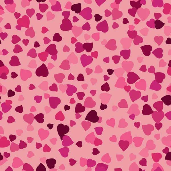 Seamless background with scattering of pink hearts — Stock Vector