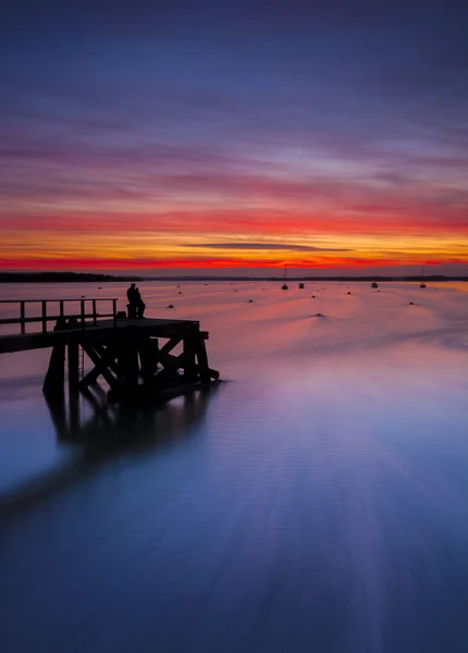 Západ slunce nad Poole Harbour na Hamworthy pier — Stock fotografie