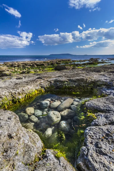 Rocas en Osmington Reflejando los colores del atardecer —  Fotos de Stock