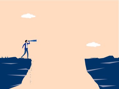 İş adamı teleskopla uçurumdaki boşluğa bakıyor.