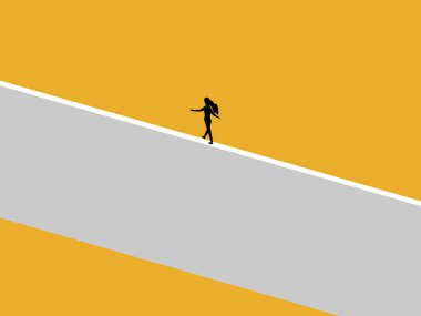 İş kadını duvarda denge kurar