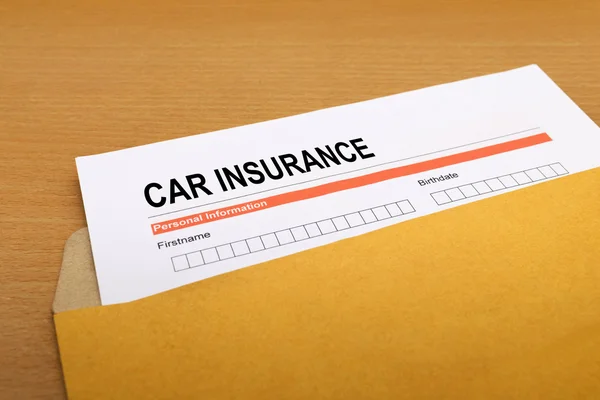 Car Insurance application form on brown envelope — Stock Photo, Image