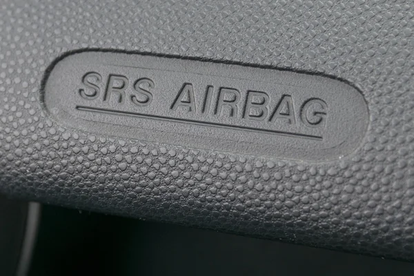 Macro de um sinal de airbag em um painel — Fotografia de Stock