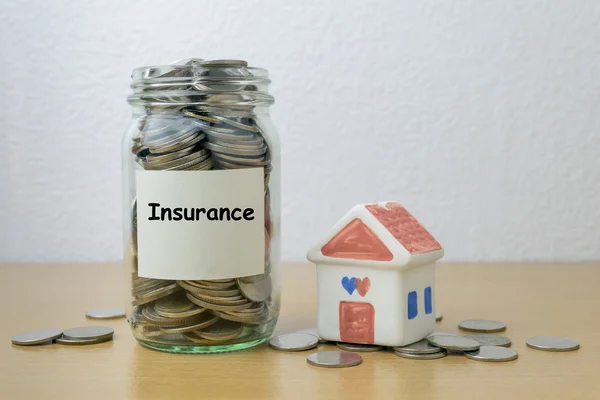 Money saving for Insurance in the glass bottle — Stock Photo, Image