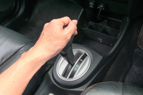 Hand on automatic gear shift — Stock Photo, Image