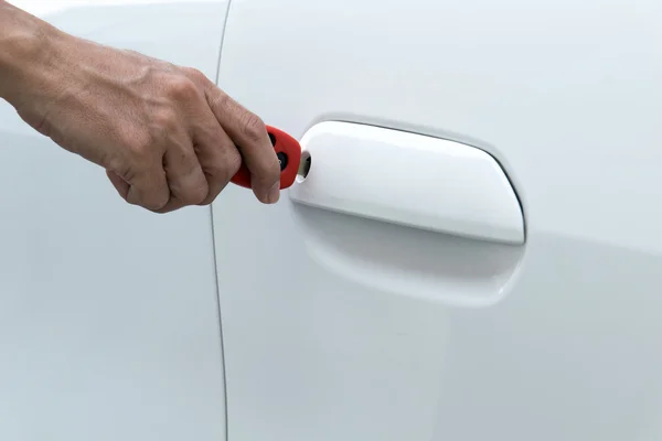 Open car door with key — Stock Photo, Image