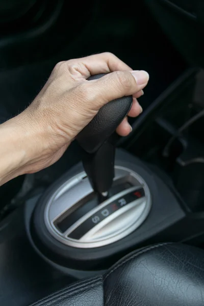 Hand on automatic gear shift — Stock Photo, Image