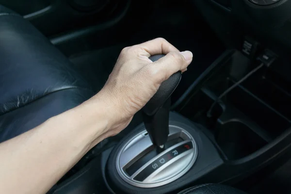 Hand on automatic gear shift — Stock Photo, Image