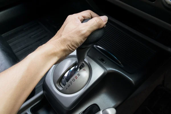 Hand on automatic gear shift — Stock Photo, Image