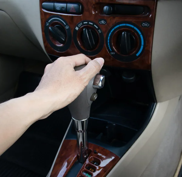 Hand on automatic gear shift — Stock Photo, Image